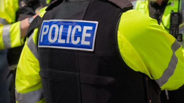 close-up-police-marking-written-1033330667.jpg