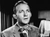 賓·克羅斯比 (Bing Crosby) 在二戰“白色聖誕節”表演中努力忍住淚水