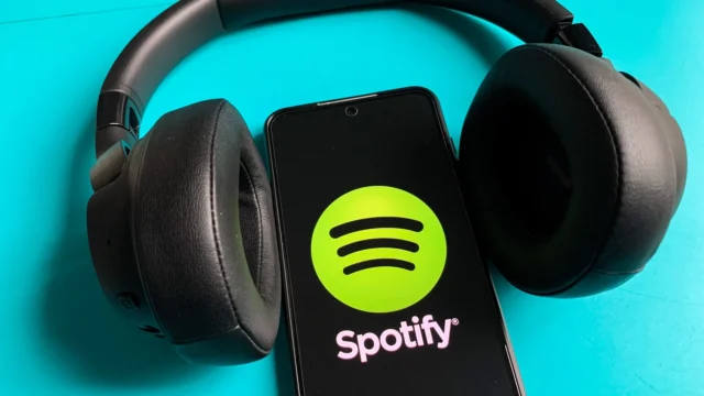 Spotify's AI Persona Label to Pluck AI Artists From Your Algorithm - CNET Two phone screens showing AI Persona badges and tagging