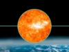太阳向地球发射强大的 M6.9 太阳耀斑和日冕物质抛射——这会增加本周出现北极光的机会吗? A close up view of the sun as a large eruption occurs - the m-class solar flare. in the background is earth from space.