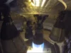 SpaceX 在巨型火箭第一次轨道飞行之前启动了星际飞船(视频) A tall finned black rocket fires an engine on a test stand in the black of night.