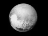为什么我们如此关心冥王星不是一颗行星? A black and white world with some white sections toward the borrom left in the shape of a heart.