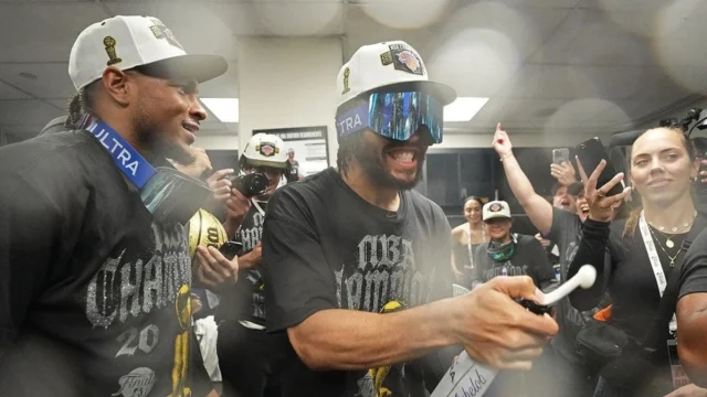 Jalen Brunson celebrating on court after winning NBA Finals at Frost Bank Center in San Antonio Texas