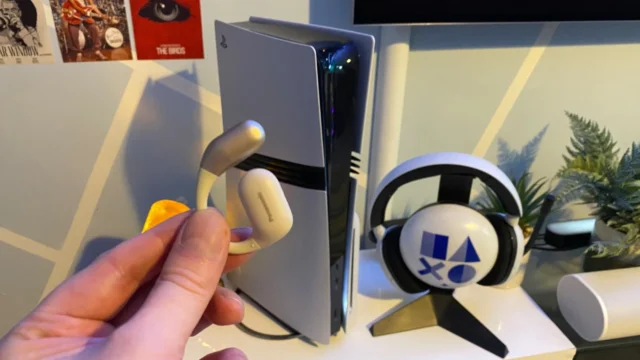 How to connect Bluetooth headphones to your PS5: Panasonic Bluetooth headphones in front of a PS5 Pro