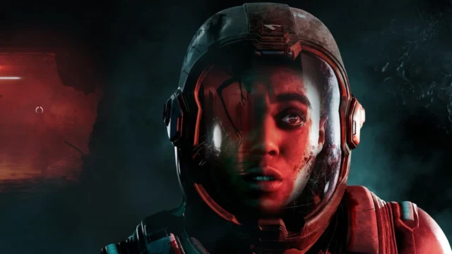 Supermassive Games will lay off up to 75 workers: A person wearing a spacesuit looks scared. Their cracked helmet shows a reflection of a humanoid figure.
