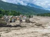 尼泊尔洪水:100多名印度公民失踪后印度大使馆拨打紧急求助热线 A torrent of muddy water flows through the Trishuli River following a flash flood triggered by the Lende river, and merges into the Bhote Koshi river, in Trishuli, Nepal.(PICS/PTI)