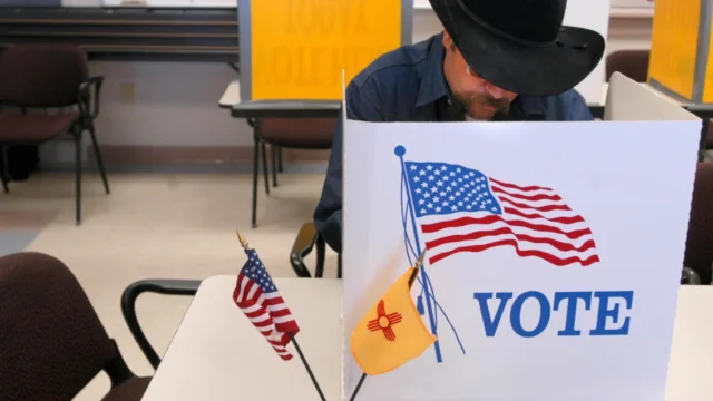 Babylon Bee sues New Mexico officials over law requiring AI disclaimers on political satire A man is seen casting a voter at a New Mexico polling site.